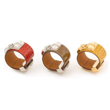 View full screen - View 1 of Lot 60. Set of Three Collier de Chien (CDC) Bracelets in Ficelle Matte Alligator Mississippiensis, Juane Ambre Shiny Alligator Mississippiensis, and Braise Shiny Alligator Mississippiensis.