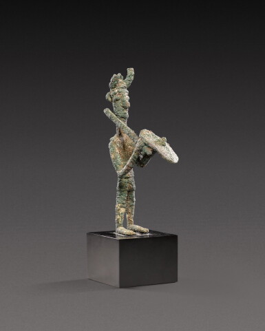 View full screen - View 1 of Lot 102. A Sardinian Bronze Figure of a Warrior, circa 7th/6th century B.C..