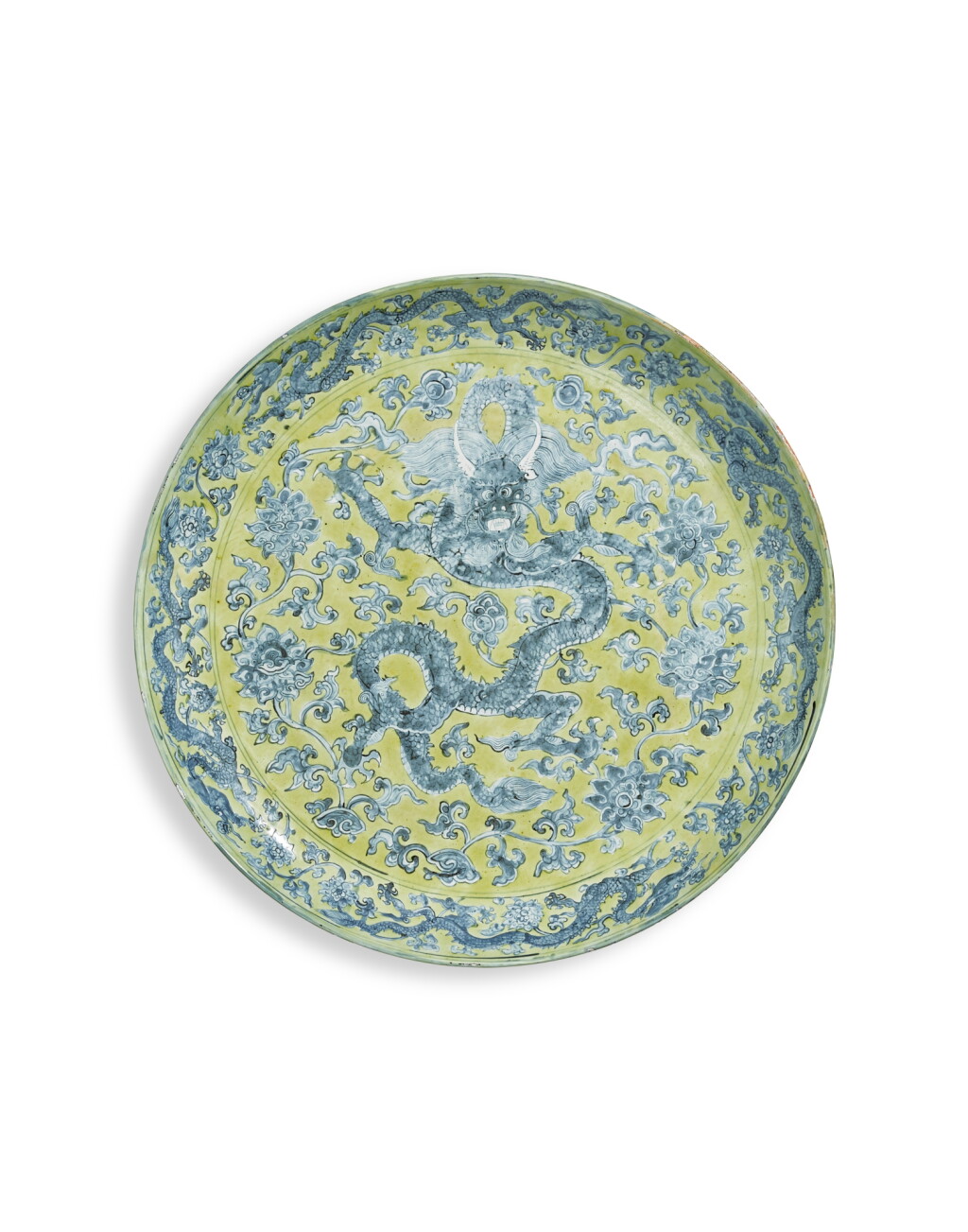 View full screen - View 1 of Lot 1071. A massive yellow-ground underglaze-blue 'dragon' charger, Mark and period Jiajing | 明嘉靖 黄地青花穿蓮龍紋大盤 《大明嘉靖年製》款.