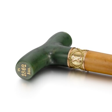 View full screen - View 1 of Lot 98. A Fabergé varicoloured gold-mounted nephrite cane handle, workmaster Michael Perkhin, St Petersburg, circa 1890.