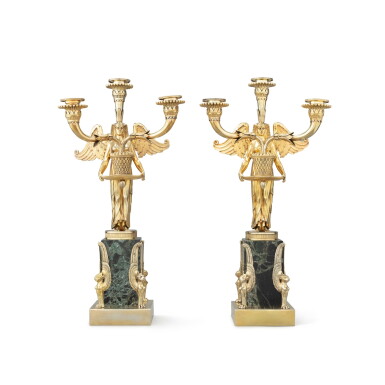 View full screen - View 1 of Lot 400. A pair of George III and Victorian Egyptian style three-light silver-gilt candelabra on marble base, branches and figures London, 1803, bases Frederick Courthope, London, 1888 | Paire de chandeliers à trois lumières de style égyptien en vermeil sur socle en marbre, les bras de lumière et les figures Londres, 1803, les bases par Frederick Courthope, Londres, 1888.