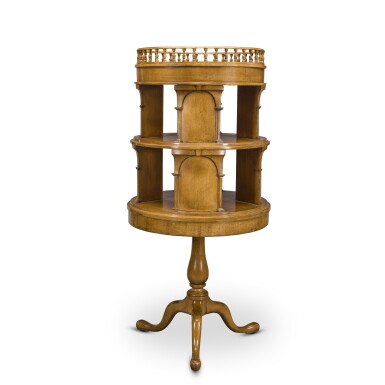 View full screen - View 1 of Lot 35. A Regency style simulated satinwood revolving bookcase, 20th century.