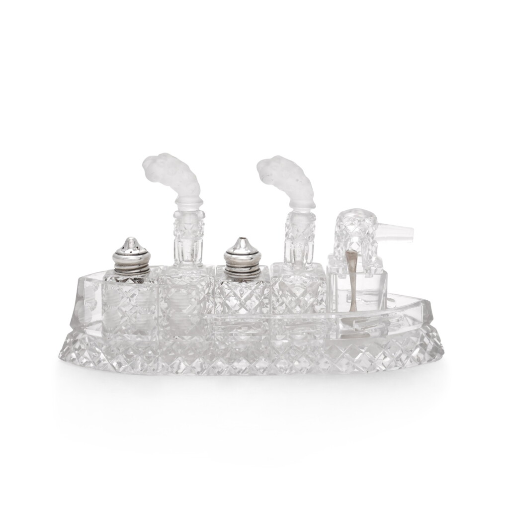 View full screen - View 1 of Lot 61. A rare silver and glass battleship cruet set, maker's mark W&Co., Birmingham 1911.