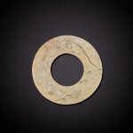 A celadon jade disc, huan, Neolithic period, Longshan culture | 新石器時代 龍山文化 玉環