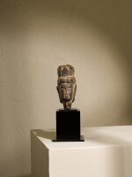 A black limestone head of a Bodhisattva, Northern Wei dynasty | 北魏 石灰岩雕觀音首像