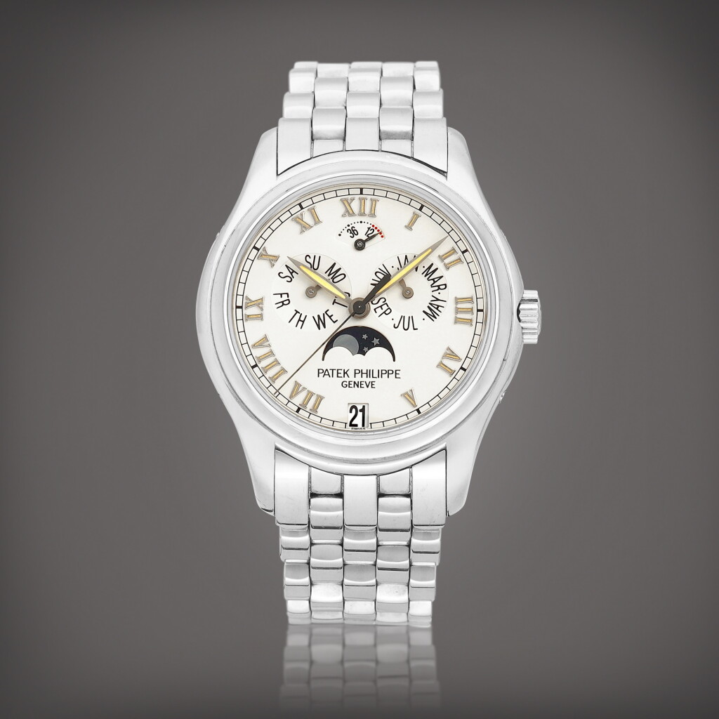 View full screen - View 1 of Lot 8704. Reference 5036 | A white gold annual calendar wristwatch with moon phases, power reserve indication and bracelet, Made in 1999 | 百達翡麗 | 型號5036 | 白金年曆鏈帶腕錶,備月相及動力儲備顯示,1999年製.