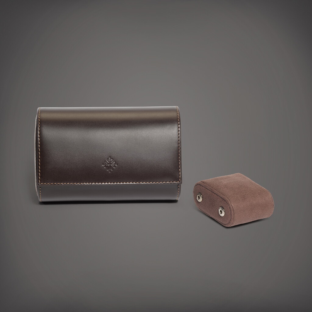 View full screen - View 1 of Lot 83. A brown calf leather roll for two watches with removable cushions | Circa 2018.