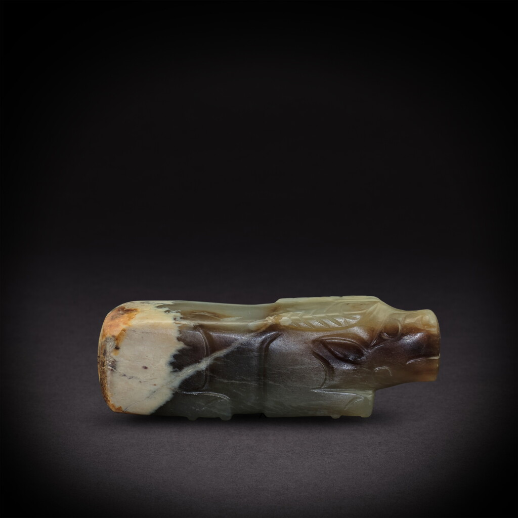 View full screen - View 1 of Lot 3523. A greyish-white jade 'buffalo' bead, Ming dynasty or earlier | 明或更早 灰白玉牛形飾.