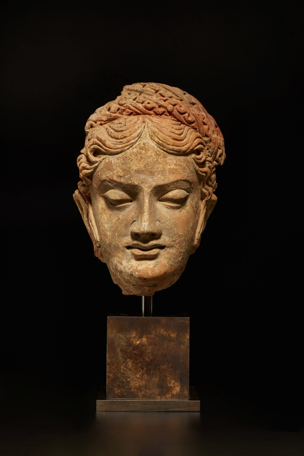 View full screen - View 1 of Lot 555. A terracotta head of a donor, Ancient Region of Gandhara, circa 5th century.