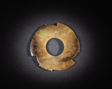 View full screen - View 1 of Lot 89. A brown jade notched disc, late Neolithic period | 新石器時代晚期 褐玉牙璧.