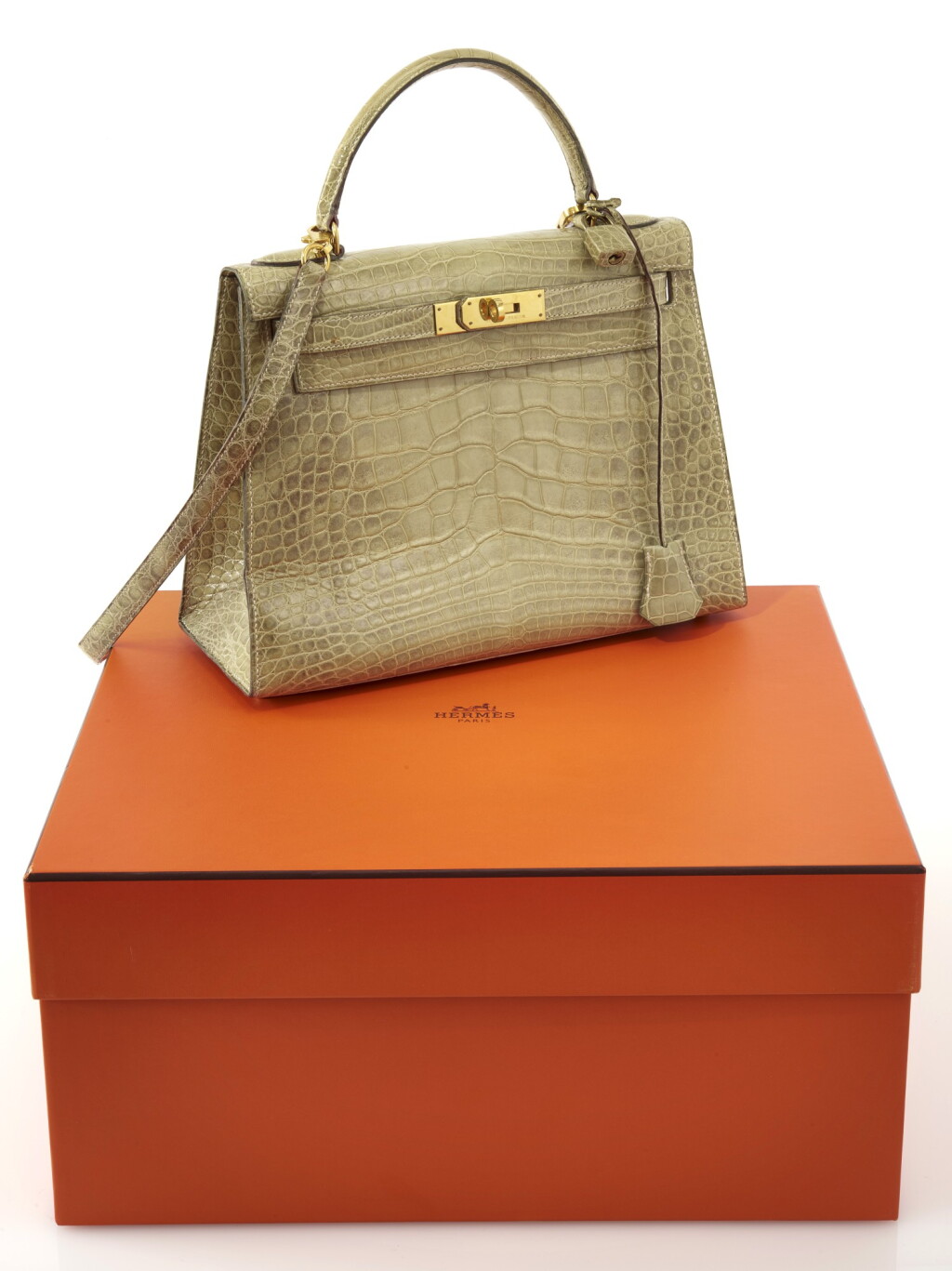 View full screen - View 1 of Lot 16. Light green alligator and gold plated hardware handbag, Kelly 29 , Hermès, 1994.
