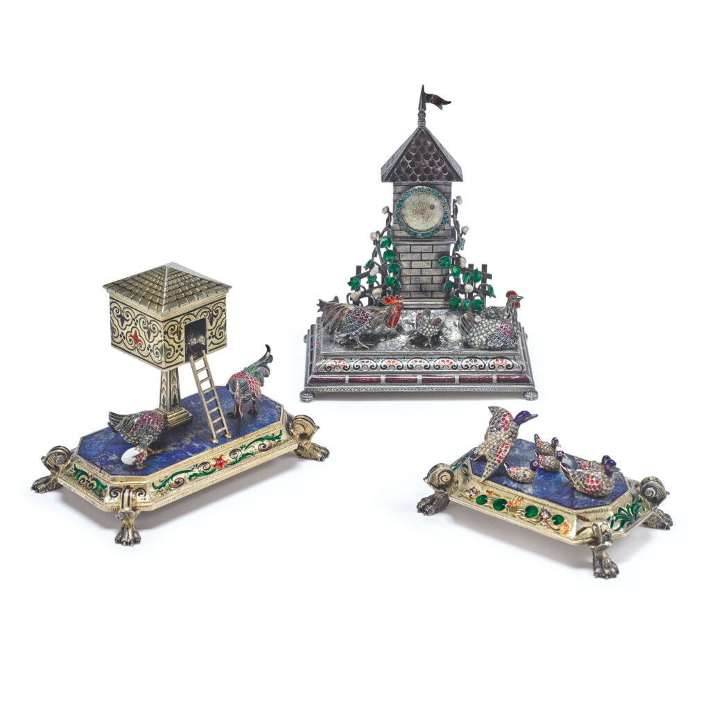 View full screen - View 1 of Lot 879. AN ASSEMBLED THREE PIECE SILVER, ENAMEL, HARDSTONE, PEARL, AND GEM-SET BARNYARD CLOCK GARNITURE, PROBABLY HANAU, LATE 19TH CENTURY.