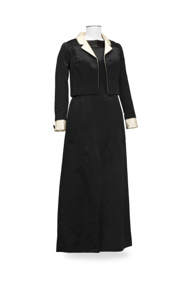 View full screen - View 1 of Lot 127. Unlabeled, circa 1962, Satin long dress and a matching short jacket | Sans griffe, Robe longue en satin et veste courte assortie.