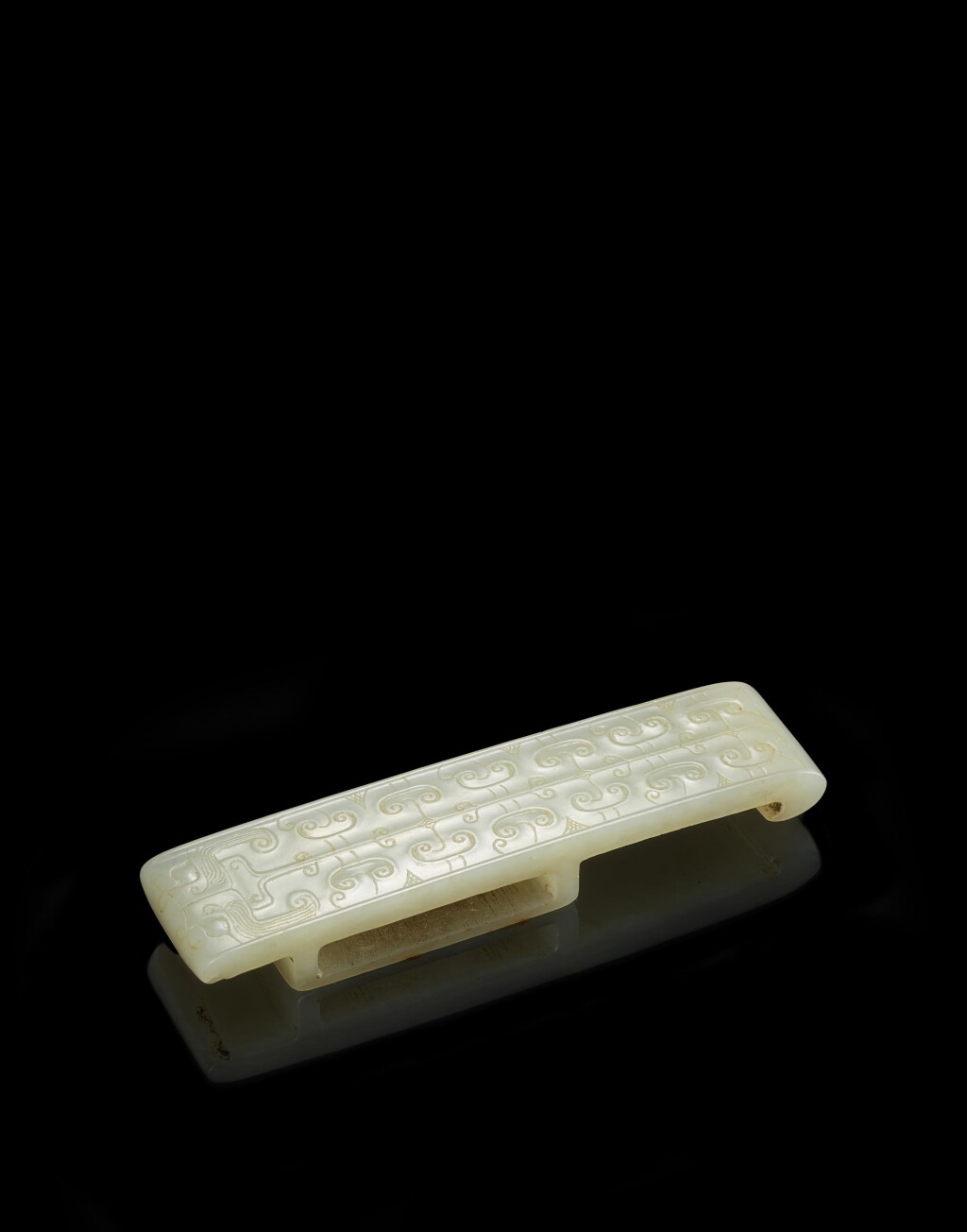 View full screen - View 1 of Lot 3766. A white jade sword slide, Western Han dynasty | 西漢 白玉勾雲紋劍璏.