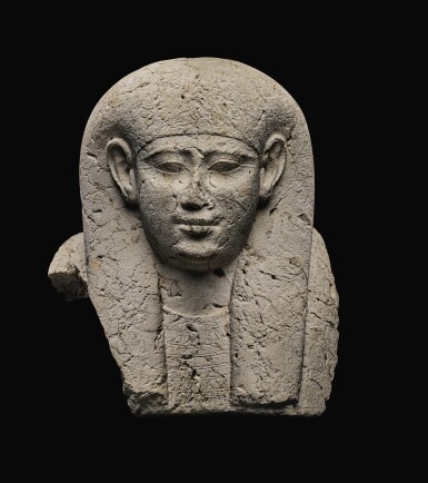 View full screen - View 1 of Lot 59. AN EGYPTIAN LIMESTONE SARCOPHAGUS MASK, 30TH DYNASTY/EARLY PTOLEMAIC PERIOD, CIRCA 250-200 B.C..