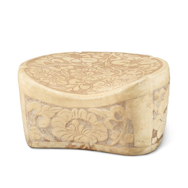 View full screen - View 1 of Lot 329. A Henan carved 'peony' pillow, Northern Song dynasty 北宋 河南珍珠地刻牡丹紋五瓣形枕.