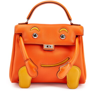 View full screen - View 1 of Lot 5582. Limited Edition Orange H and Jaune Soleil Swift Sogo Hong Kong Quelle Idole Kelly Doll Palladium Hardware, 2010.
