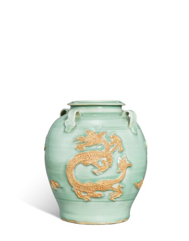 View full screen - View 1 of Lot 156. A 'Longquan' celadon-glazed and biscuit-decorated 'dragon' four-handled jar, Yuan dynasty.
