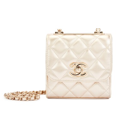 View full screen - View 1 of Lot 14. Metallic Gold Lambskin Mini Trendy CC Clutch with Chain Gold Hardware, 2021.