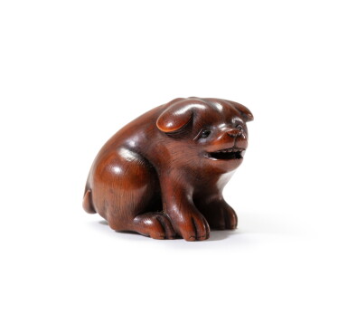 View full screen - View 1 of Lot 186. A carved wood study of a seated puppy Japan, Edo period | 日本 江戶時代 木雕坐犬根付.