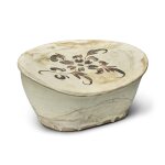 A painted 'Cizhou' 'floral' pillow, Song dynasty | 宋 磁州窰白地黑花枕
