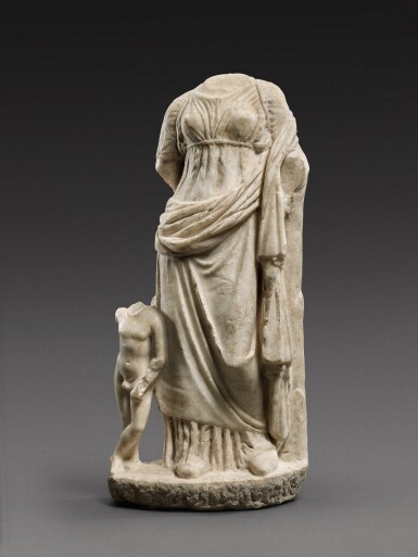 View full screen - View 1 of Lot 23. A Greek Marble Figure of Aphrodite with Eros, late 4th Century B.C..