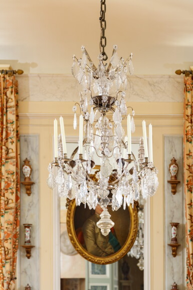View full screen - View 1 of Lot 209. A silvered bronze and cut glass chandelier, in Louis XV style | Lustre en bronze argenté et verre taillé de style Louis XV.