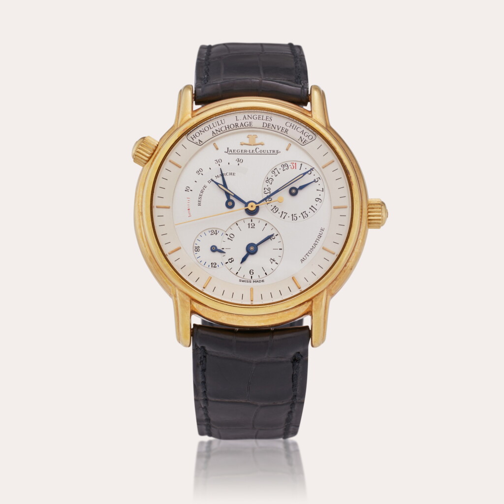 View full screen - View 1 of Lot 574. Reference 169.1.92 Géographique | A yellow gold automatic dual time zone wristwatch with date, 24-hour and power reserve indication, Circa 1991.