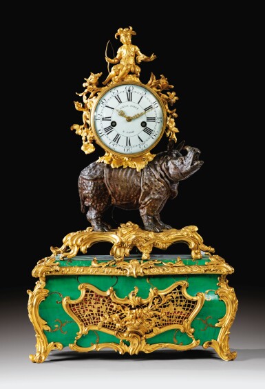 View full screen - View 1 of Lot 10. A GILT-BRONZE MOUNTED PATINATED BRONZE RHINOCEROS 'CORNE VERTE' MUSICAL TABLE CLOCK, LOUIS XV, BY JEAN-JOSEPH DE SAINT-GERMAIN, CIRCA, 1750 | PENDULE À MUSIQUE AU RHINOCÉROS EN BRONZE PATINÉ, DORÉ ET CORNE VERTE D'ÉPOQUE LOUIS XV, VERS 1750, PAR JEAN-JOSEPH DE SAINT-GERMAIN.