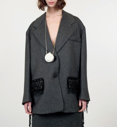 View full screen - View 1 of Lot 30. PRADA | BEADED FRINGES WOOL CABAN JACKET, WOOL SKIRT, VANITY NECKLACE, METAL HEADBAND AND LEATHER PUMPS WITH EMBROIDERED GAITER. UNIQUE LOOK (EXCEPT HEADBAND) NOT IN THE STORES.
