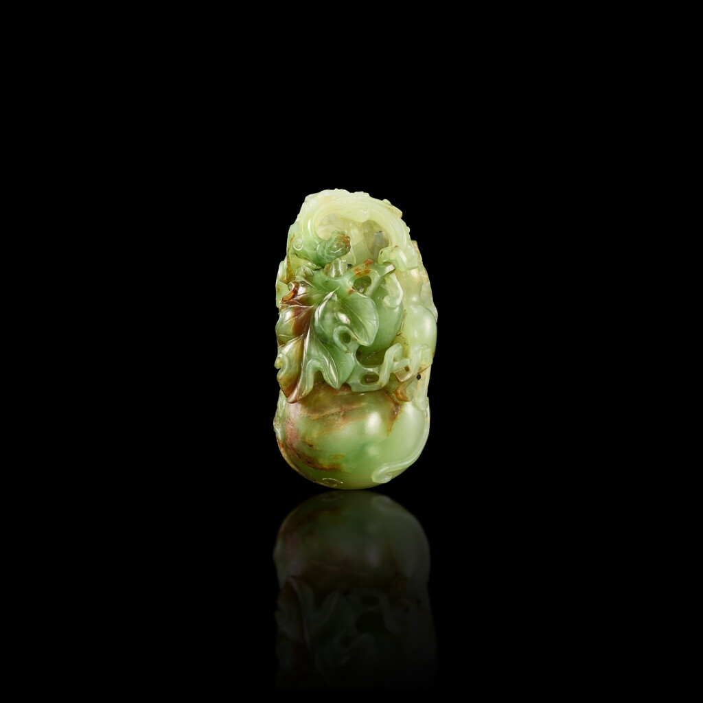 View full screen - View 1 of Lot 445. A pale green and russet jade 'double-gourd' carving, Qing dynasty, 18th century 清十八世紀 淺青玉葫蘆把件.