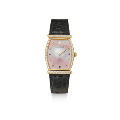 View full screen - View 1 of Lot 8174. AUDEMARS PIGUET | CARNEGIE A YELLOW GOLD, DIAMOND AND RUBY-SET WRISTWATCH WITH PINK MOTHER-OF-PEARL DIAL, CIRCA 2000.
