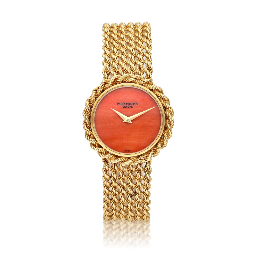View full screen - View 1 of Lot 258. Reference 4282 1 | A yellow gold bracelet watch with coral dial, Circa 1975.