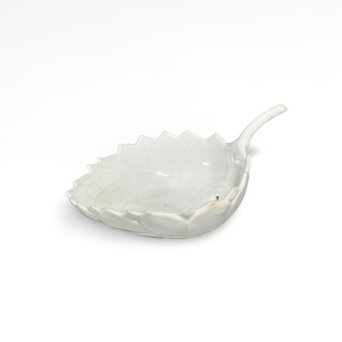 View full screen - View 1 of Lot 373. A white-glazed moulded 'lotus' water dropper, Mark and period of Guangxu | 清光緒 白釉荷花式盃《大清光緒年製》款.