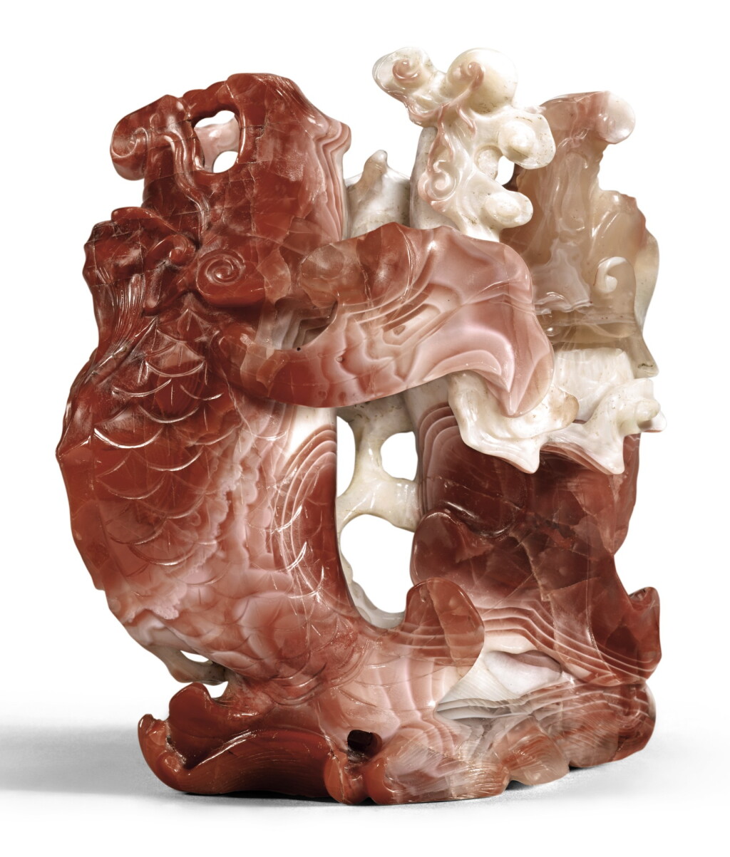 View full screen - View 1 of Lot 125. A CARNELIAN AGATE 'DRAGON CARP' VASE QING DYNASTY, QIANLONG PERIOD | 清乾隆 南紅瑪瑙雙魚花插.