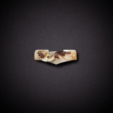 View full screen - View 1 of Lot 3498. A white and russet jade 'chilong' sword guard, Han dynasty | 漢 白玉螭龍紋劍鐔.