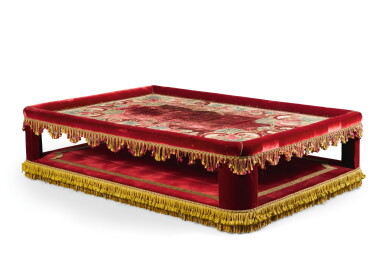 View full screen - View 1 of Lot 11. A RED VELVET AND VELVET APPLIQUÉ BANQUETTE INCORPORATING A LOUIS XIV PANEL, DESIGNED BY JACQUES GARCIA, THE PANEL EARLY 18TH CENTURY.