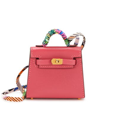 View full screen - View 1 of Lot 94. Set of Two Micro Mini Kelly Twilly Bag Charms: Argile Tadelakt Palladium Hardware, 2021, and Rose Lipstick Tadelakt Gold Hardware, 2022.