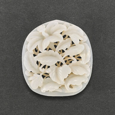 View full screen - View 1 of Lot 539. A WHITE JADE RETICULATED 'BIRD AND FLOWER' PLAQUE SONG - YUAN DYNASTY | 宋至元 白玉鏤雕花鳥紋杏形珮飾.