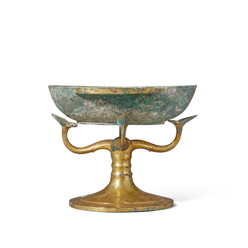 View full screen - View 1 of Lot 631. A gilt-bronze stand and ear cup, Western Han dynasty | 西漢 銅鎏金架座及羽觴.