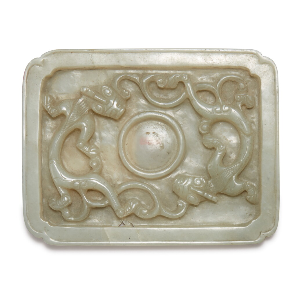 View full screen - View 1 of Lot 942. A PALE GRAY JADE RECTANGULAR 'CHILONG' CUP STAND, LATE MING DYNASTY.