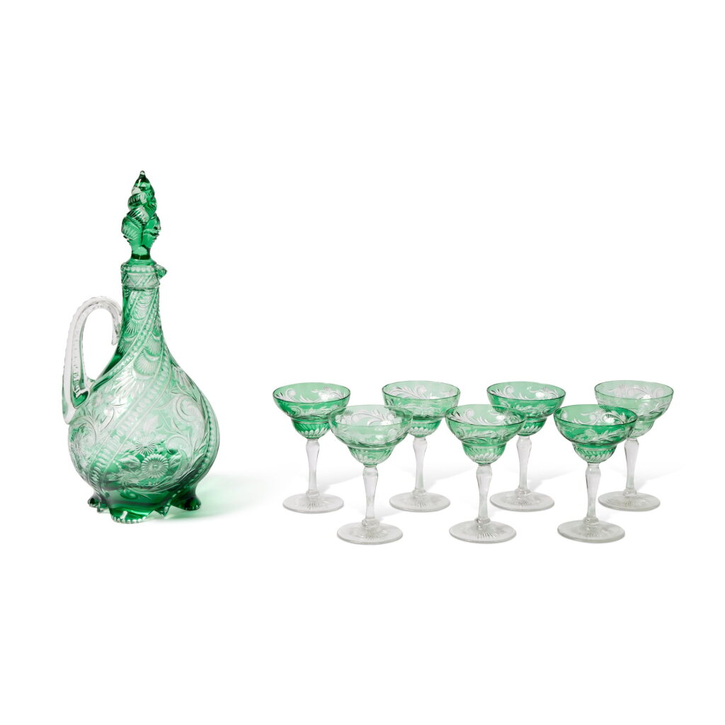View full screen - View 1 of Lot 309. A Stevens and Williams Intaglio-Cut Green Glass Decanter and Stopper and Seven Glasses, Circa 1900.