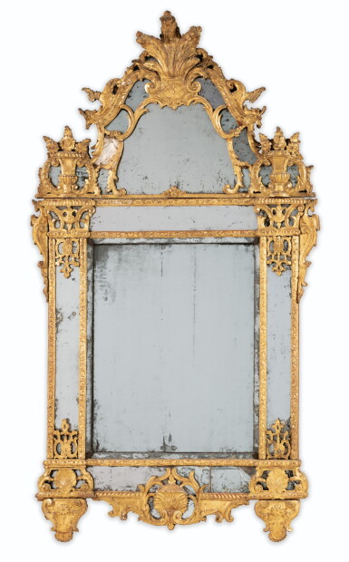 View full screen - View 1 of Lot 24. A REGENCE CARVED GILT-WOOD MIRROR | MIROIR À FRONTON ET ENCADREMENT À DOUBLE BAGUETTES EN BOIS SCULPTÉ ET DORÉ D'ÉPOQUE RÉGENCE.