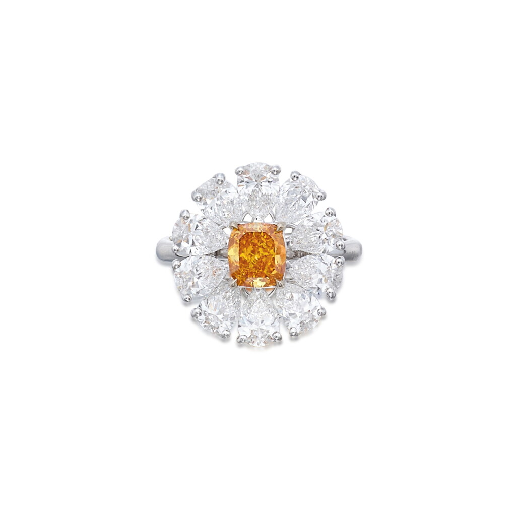 View full screen - View 1 of Lot 30. A Rare Fancy Vivid Orange Diamond and Diamond Ring.