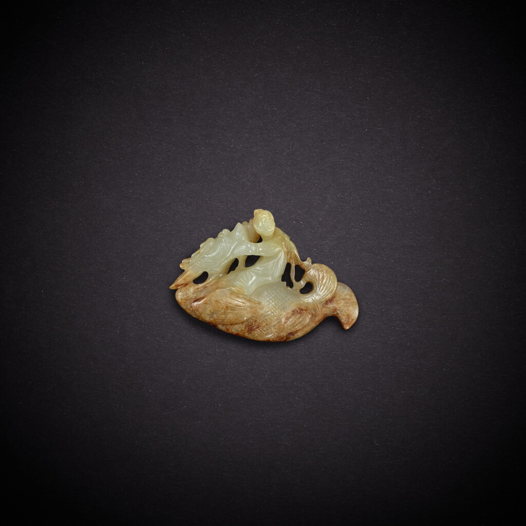 View full screen - View 1 of Lot 3539. A pale celadon jade 'immortal and dragon-fish' pendant, Song dynasty | 宋 青白玉龍魚仙人墜.