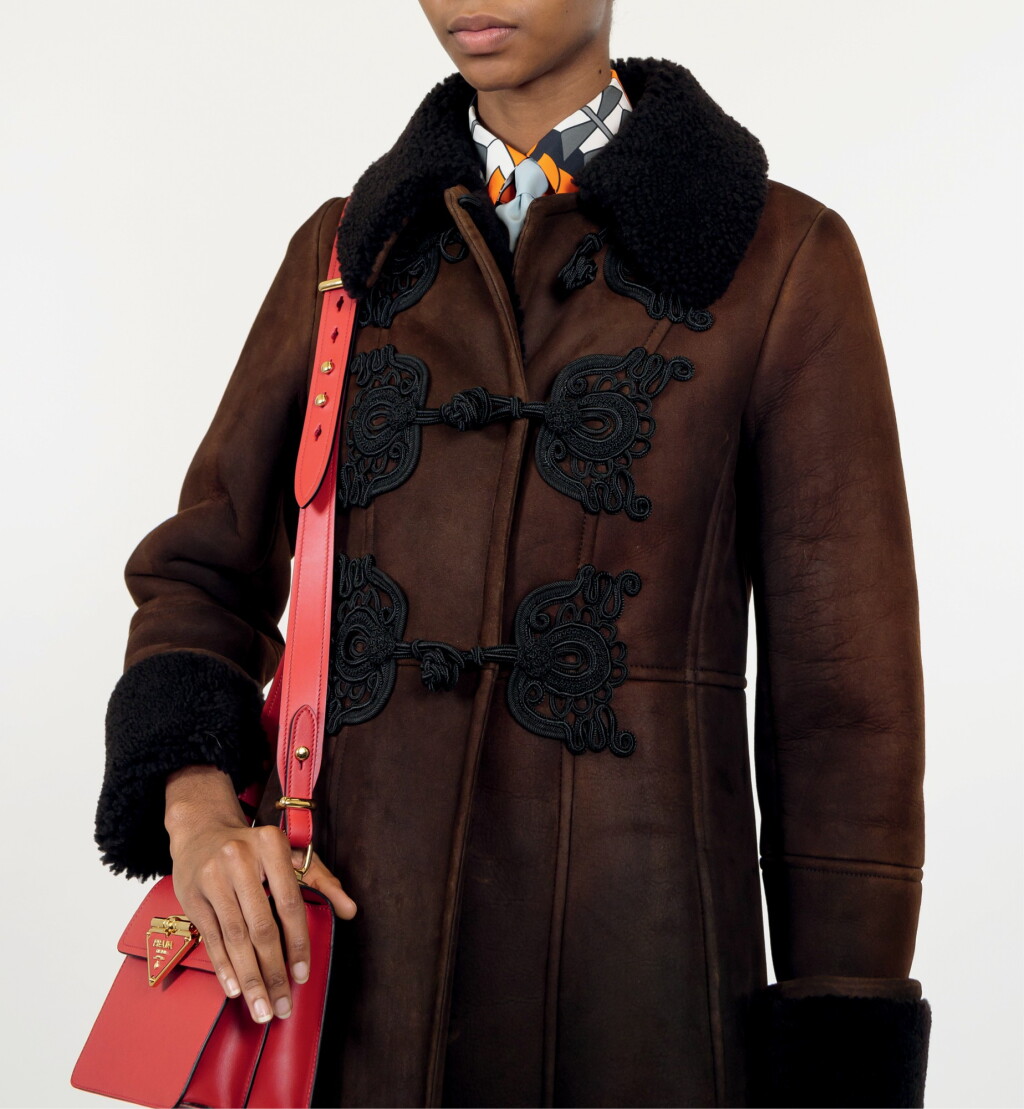 View full screen - View 1 of Lot 17. PRADA | SHEARLING COAT WITH SILK TRIMMING, POPLIN PRINTED SHIRT, POPLIN TIE, METAL HEADBAND UNIQUE READY-TO-WEAR NOT IN THE STORES.