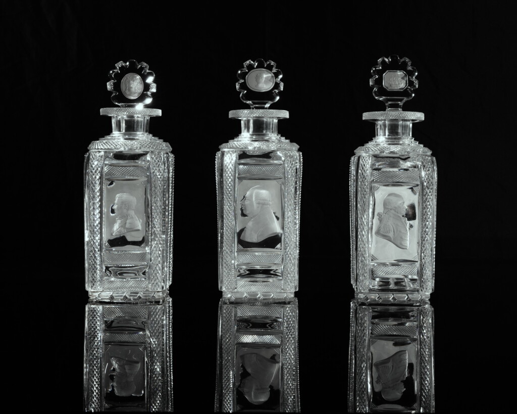 View full screen - View 1 of Lot 705. A rare set of three Apsley Pellatt cut glass sulphide decanters and stoppers, circa 1820-30.