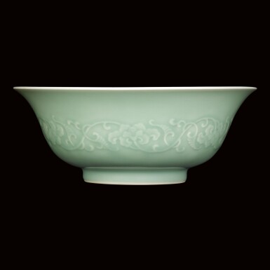 View full screen - View 1 of Lot 119. A FINE AND RARE CARVED CELADON-GLAZED 'FLORAL' BOWL MARK AND PERIOD OF YONGZHENG | "清雍正 青釉淺浮雕纏枝花卉紋盌 《大清雍正年製》款".