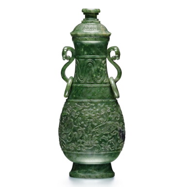View full screen - View 1 of Lot 33. A large spinach-green jade vase and cover, Qing dynasty, 19th century | 清十九世紀 碧玉雕八吉祥紋如意耳活環大蓋瓶.