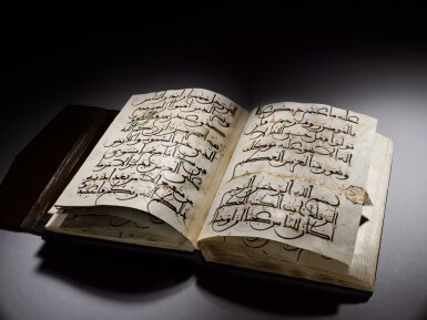 View full screen - View 1 of Lot 116. A large illuminated volume from an eight-volume Qur'an in Maghribi script on paper, Spain or North Africa, 15th century.